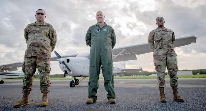 Photo of Air Force Reservists 1st. Lt. Jonathan Rothe, Col. Josh Flatley and Tech. Sgt. Glenda Nathaniel.