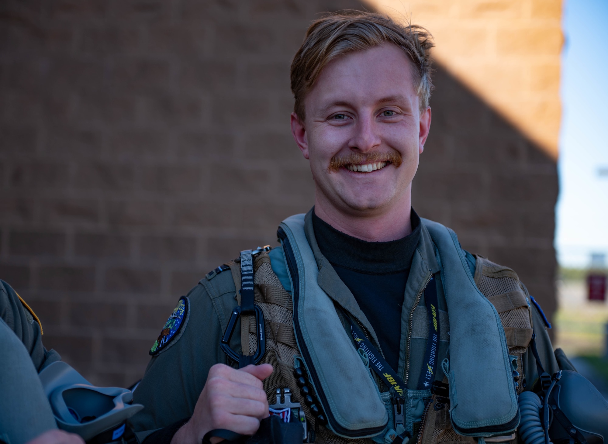 A troop shows off their mustache while at RED FLAG-Alaska