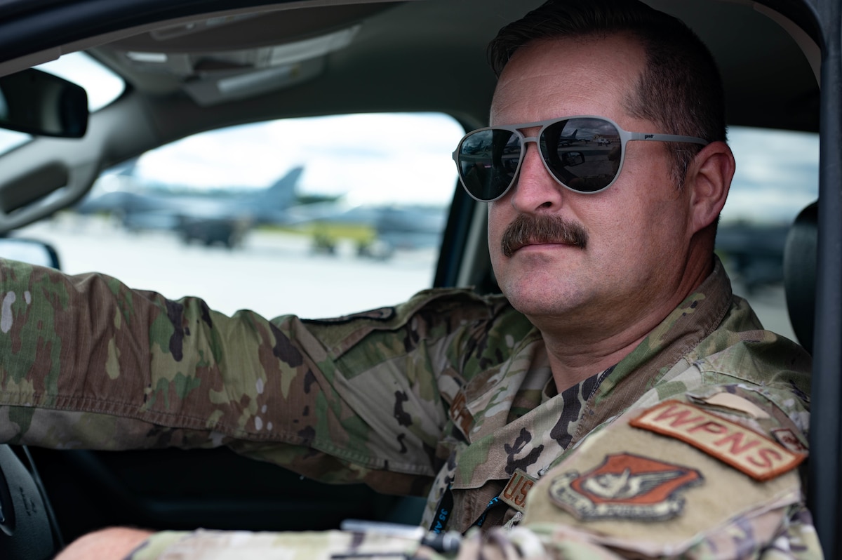 A troop shows off their mustache while at RED FLAG-Alaska