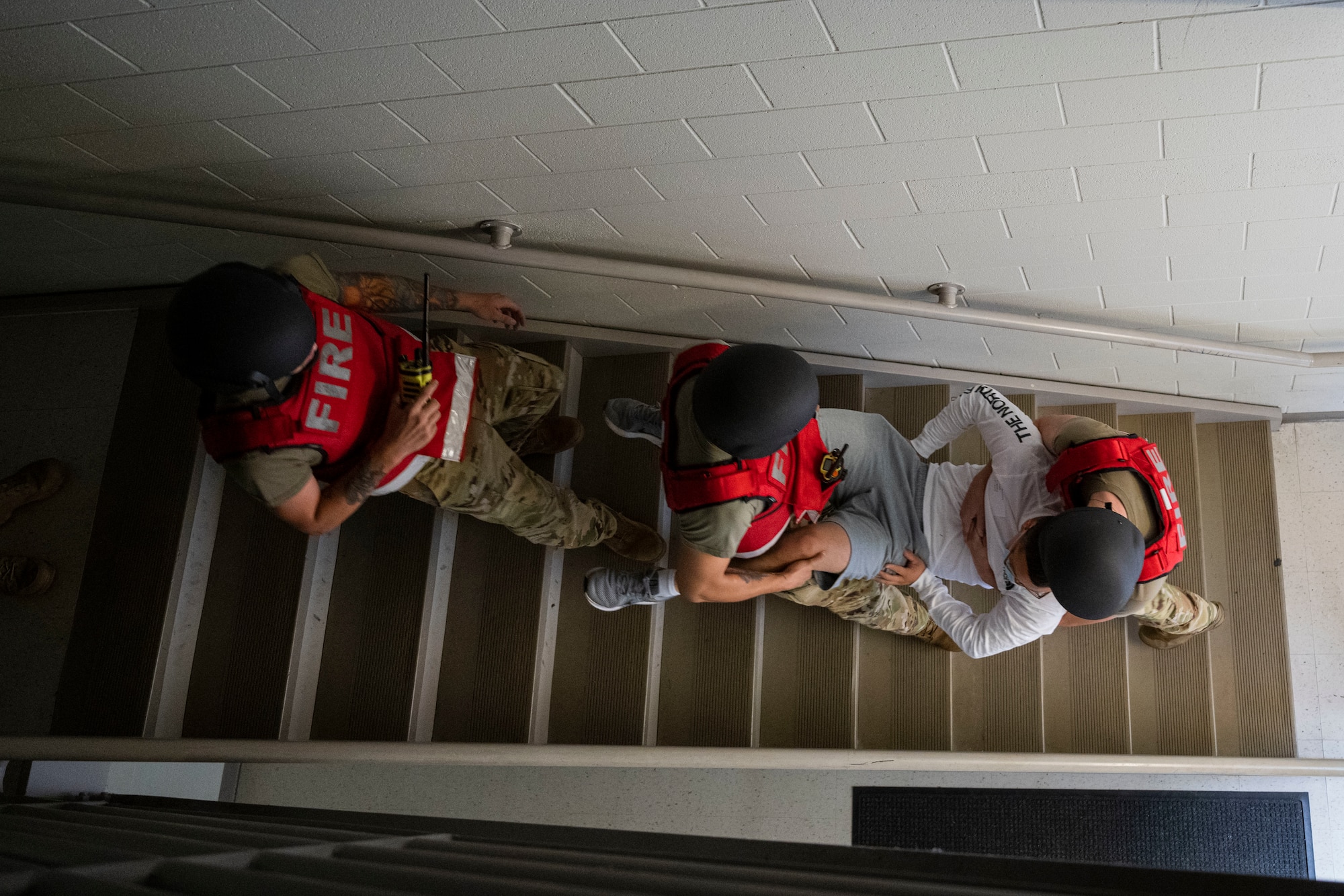 Airmen assigned to the 4th Civil Engineer Squadron Fire Department carry a simulated injured person during an active shooter exercise at Seymour Johnson Air Force Base, North Carolina, Aug. 19, 2022. This was the first active shooter exercise conducted in 2022.