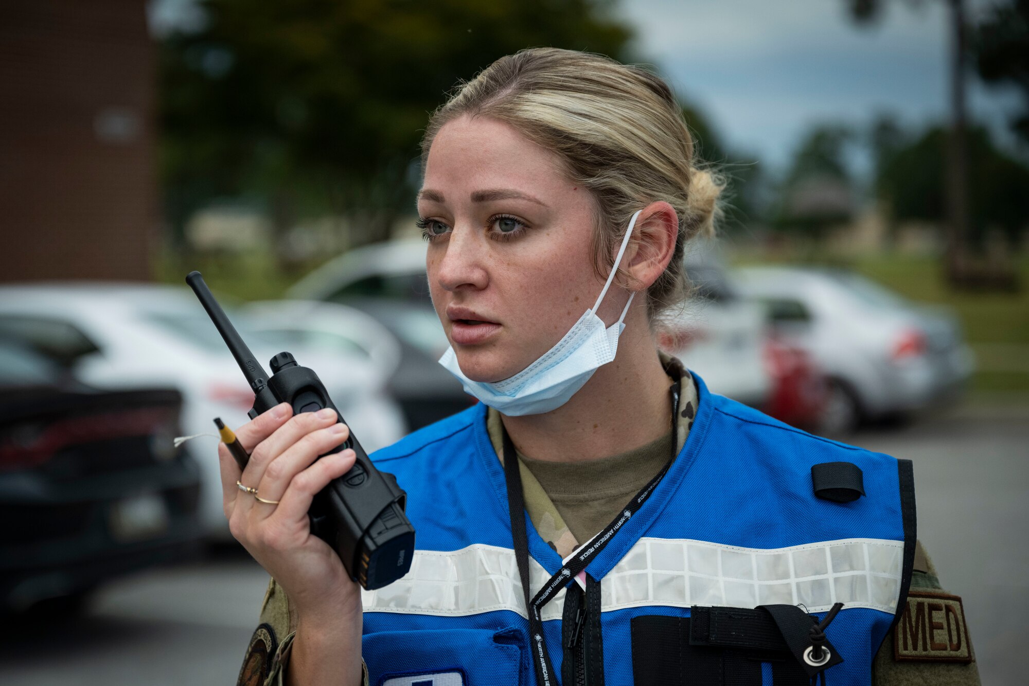 Tech. Sgt. Haley Bass, 4th Operational Medical Readiness Squadron medical technician, uses a radio during an active shooter exercise at Seymour Johnson Air Force Base, North Carolina, Aug. 19, 2022. The 4th Medical Group conducted triage and patient care during the exercise.