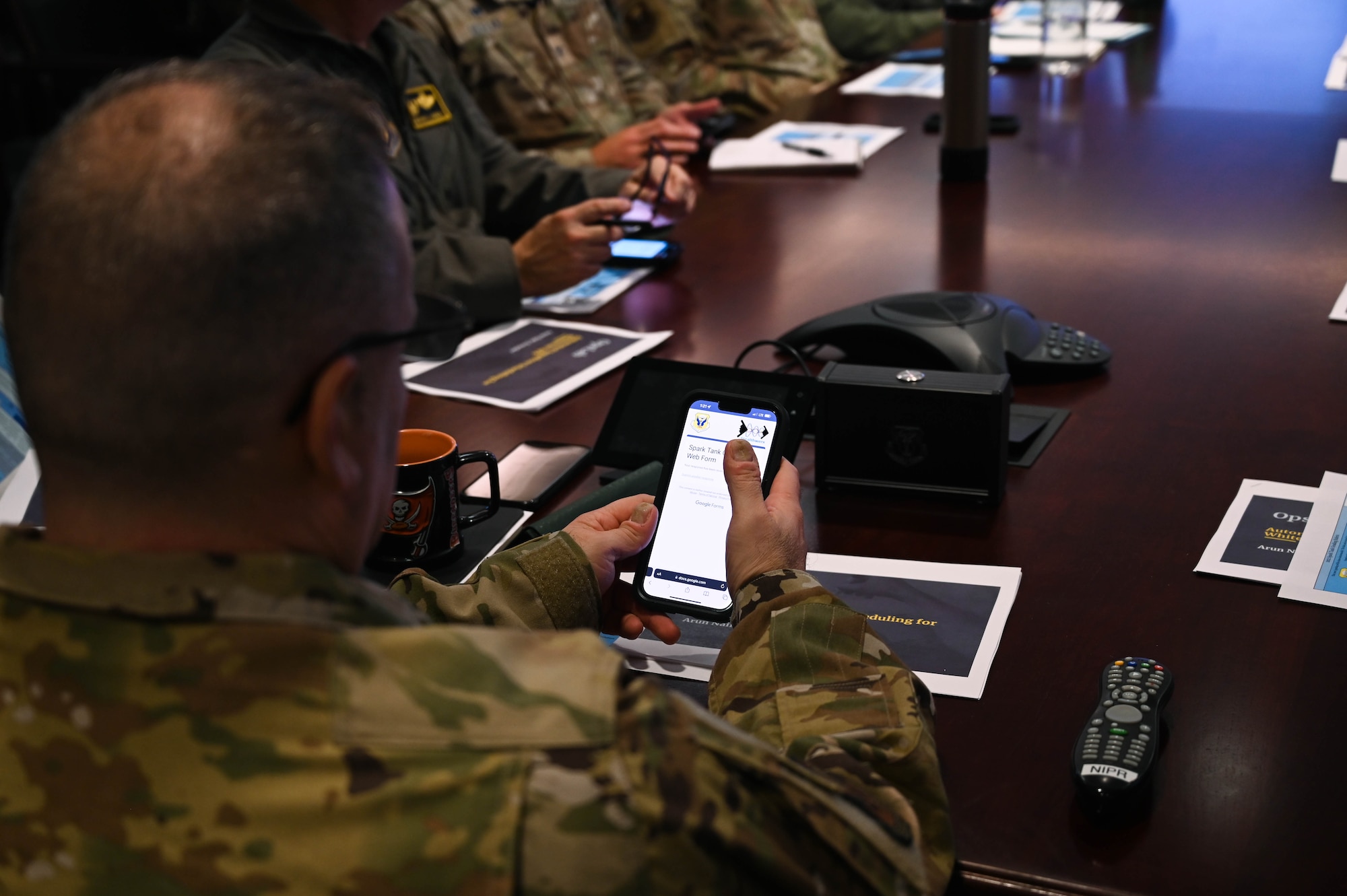 U.S. Air Force Col. Maxwell DiPietro, 509th Bomb Wing vice commander, uses the grading system for the Stealthwerx Spark Tank competition at Whiteman Air Force Base, Missouri, August 16, 2022. Spark Tank is designed to promote innovation within the Air Force. Winners of the annual Spark Tank competition will advance on to represent Whiteman AFB at the Air Force Global Strike Strikewerx Spark Sprint competition in fall of 2022. (U.S. Air Force photo by Airman 1st Class)