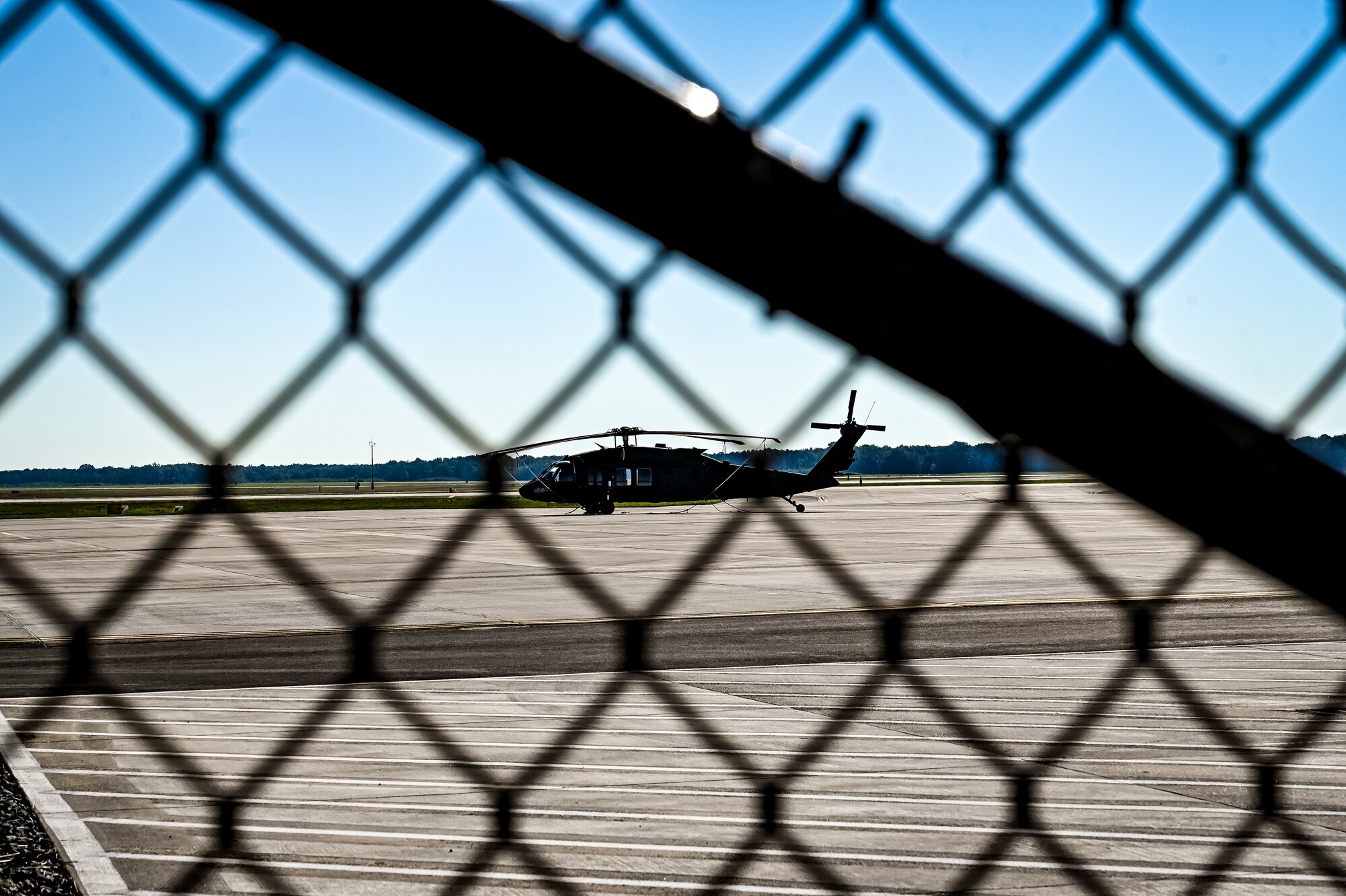 A UH-60 Black Hawk assigned to Army Support Activity Fort Dix, sits stationary on the newly constructed U.S. Army Aviation Facility ramp at Joint Base McGuire-Dix-Lakehurst N.J. on Aug. 19, 2022. The Army Aviation Facility Project was a MILCON effort valued at 11.7 million dollars and made possible through the joint effort of ASA Fort Dix and the U.S. Marine Corps Marine Aircraft Group 49. The 2100 square foot building is host to an Army Ramp Management Area which provides a wide range of capabilities for both fixed and rotary wing aircraft such as the C-130, CH-47S, and UH-60S. The addition of the new Army Ramp will provide enhanced load out and aviation operation training capabilities, parking for Army aviation aircraft, refueling, troop movement and flight planning operations for approximately 216,000 people that use JB MDL to meet readiness requirements.