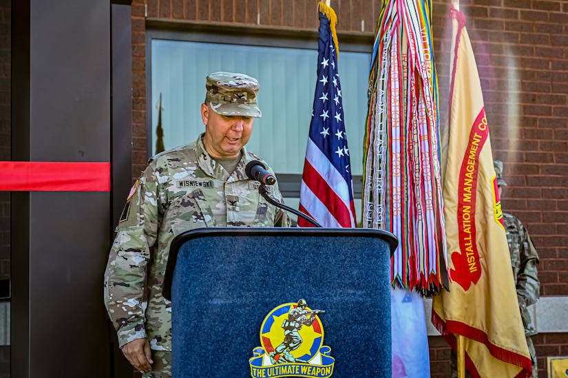 U.S. Army Col. Mitchell Wisniewski, Joint Base McGuire-Dix-Lakehurst deputy commander, and Army Support Activity Fort Dix commander, gives an address at the Army Support Activity Fort Dix Aviation Facility ribbon cutting ceremony at Joint Base McGuire-Dix-Lakehurst N.J. on Aug. 19, 2022. The Army Aviation Facility Project was a MILCON effort valued at 11.7 million dollars and made possible through the joint effort of ASA Fort Dix and the U.S. Marine Corps Marine Aircraft Group 49. The 2100 square foot building is host to an Army Ramp Management Area which provides a wide range of capabilities for both fixed and rotary wing aircraft such as the C-130, CH-47S, and UH-60S. The addition of the new Army Ramp will provide enhanced load out and aviation operation training capabilities, parking for Army aviation aircraft, refueling, troop movement and flight planning operations for approximately 216,000 people that use JB MDL to meet readiness requirements.