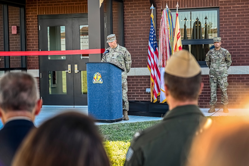 U.S. Army Col. Mitchell Wisniewski, Joint Base McGuire-Dix-Lakehurst deputy commander, and Army Support Activity Fort Dix commander, gives an address at the Army Support Activity Fort Dix Aviation Facility ribbon cutting ceremony at Joint Base McGuire-Dix-Lakehurst N.J. on Aug. 19, 2022. The Army Aviation Facility Project was a MILCON effort valued at 11.7 million dollars and made possible through the joint effort of ASA Fort Dix and the U.S. Marine Corps Marine Aircraft Group 49. The 2100 square foot building is host to an Army Ramp Management Area which provides a wide range of capabilities for both fixed and rotary wing aircraft such as the C-130, CH-47S, and UH-60S. The addition of the new Army Ramp will provide enhanced load out and aviation operation training capabilities, parking for Army aviation aircraft, refueling, troop movement and flight planning operations for approximately 216,000 people that use JB MDL to meet readiness requirements.