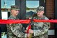 U.S. Army Col. Mitchell Wisniewski, Joint Base McGuire-Dix-Lakehurst deputy commander, and Army Support Activity Fort Dix commander, and U.S. Army Command Sgt. Maj. James Van Zlike, Army Support Activity Fort Dix command sergeant major, cut a ribbon during the Army Support Activity Fort Dix Aviation Facility ribbon cutting ceremony at Joint Base McGuire-Dix-Lakehurst N.J. on Aug. 19, 2022. The Army Aviation Facility Project was a MILCON effort valued at 11.7 million dollars and made possible through the joint effort of ASA Fort Dix and the U.S. Marine Corps Marine Aircraft Group 49. The 2100 square foot building is host to an Army Ramp Management Area which provides a wide range of capabilities for both fixed and rotary wing aircraft such as the C-130, CH-47S, and UH-60S. The addition of the new Army Ramp will provide enhanced load out and aviation operation training capabilities, parking for Army aviation aircraft, refueling, troop movement and flight planning operations for approximately 216,000 people that use JB MDL to meet readiness requirements.