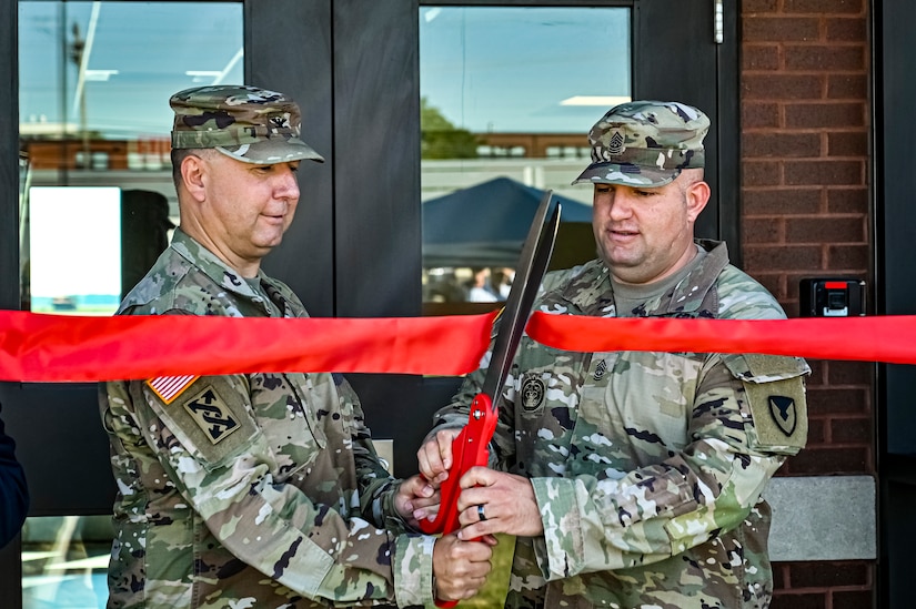 U.S. Army Col. Mitchell Wisniewski, Joint Base McGuire-Dix-Lakehurst deputy commander, and Army Support Activity Fort Dix commander, and U.S. Army Command Sgt. Maj. James Van Zlike, Army Support Activity Fort Dix command sergeant major, cut a ribbon during the Army Support Activity Fort Dix Aviation Facility ribbon cutting ceremony at Joint Base McGuire-Dix-Lakehurst N.J. on Aug. 19, 2022. The Army Aviation Facility Project was a MILCON effort valued at 11.7 million dollars and made possible through the joint effort of ASA Fort Dix and the U.S. Marine Corps Marine Aircraft Group 49. The 2100 square foot building is host to an Army Ramp Management Area which provides a wide range of capabilities for both fixed and rotary wing aircraft such as the C-130, CH-47S, and UH-60S. The addition of the new Army Ramp will provide enhanced load out and aviation operation training capabilities, parking for Army aviation aircraft, refueling, troop movement and flight planning operations for approximately 216,000 people that use JB MDL to meet readiness requirements.