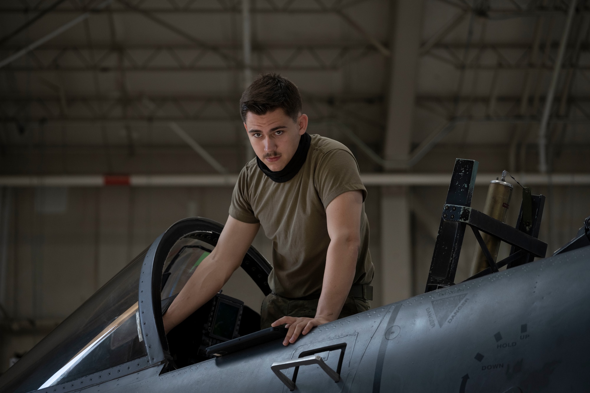 Airman 1st Class Garrett Loeschen, 4th Component Maintenance Squadron electrical and environmental journeyman, prepares an F-15E Strike Eagle for an electrical system test at Seymour Johnson Air Force Base, North Carolina, Aug. 9, 2022. During the test, Loeschen alternated power from the left and the right side of the aircraft as other Airmen ensured the systems were working properly. (U.S. Air Force photo by Senior Airman Kevin Holloway)