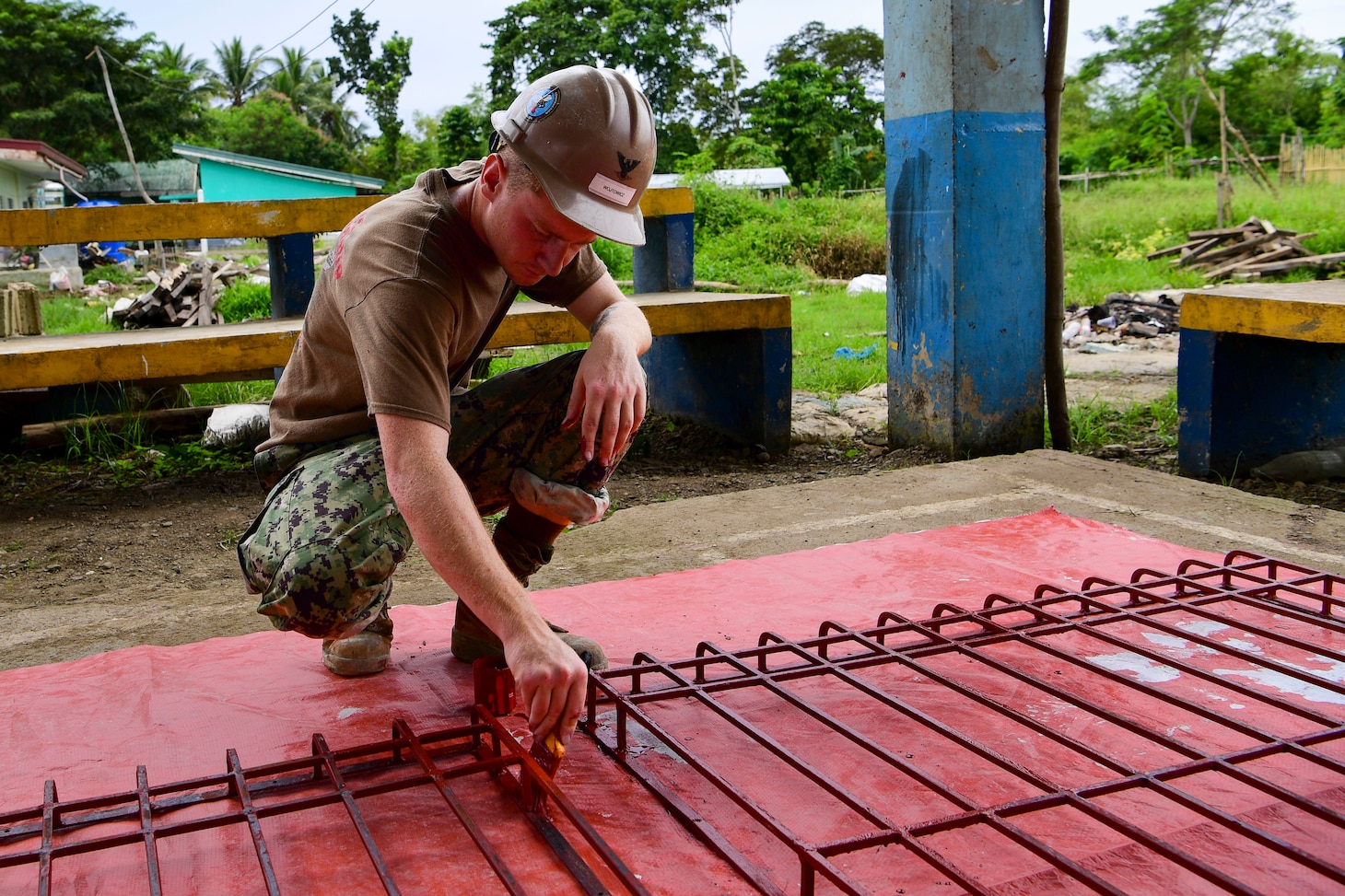 Construction Electrician 3rd Class Aaron Clifford, assigned to Amphibious Construction Battalion One (ACB 1), paints during a renovation project at Salvacion Barangay in support of Pacific Partnership 2022. Now in its 17th year, Pacific Partnership is the largest annual multinational humanitarian assistance and disaster relief preparedness mission conducted in the Indo-Pacific