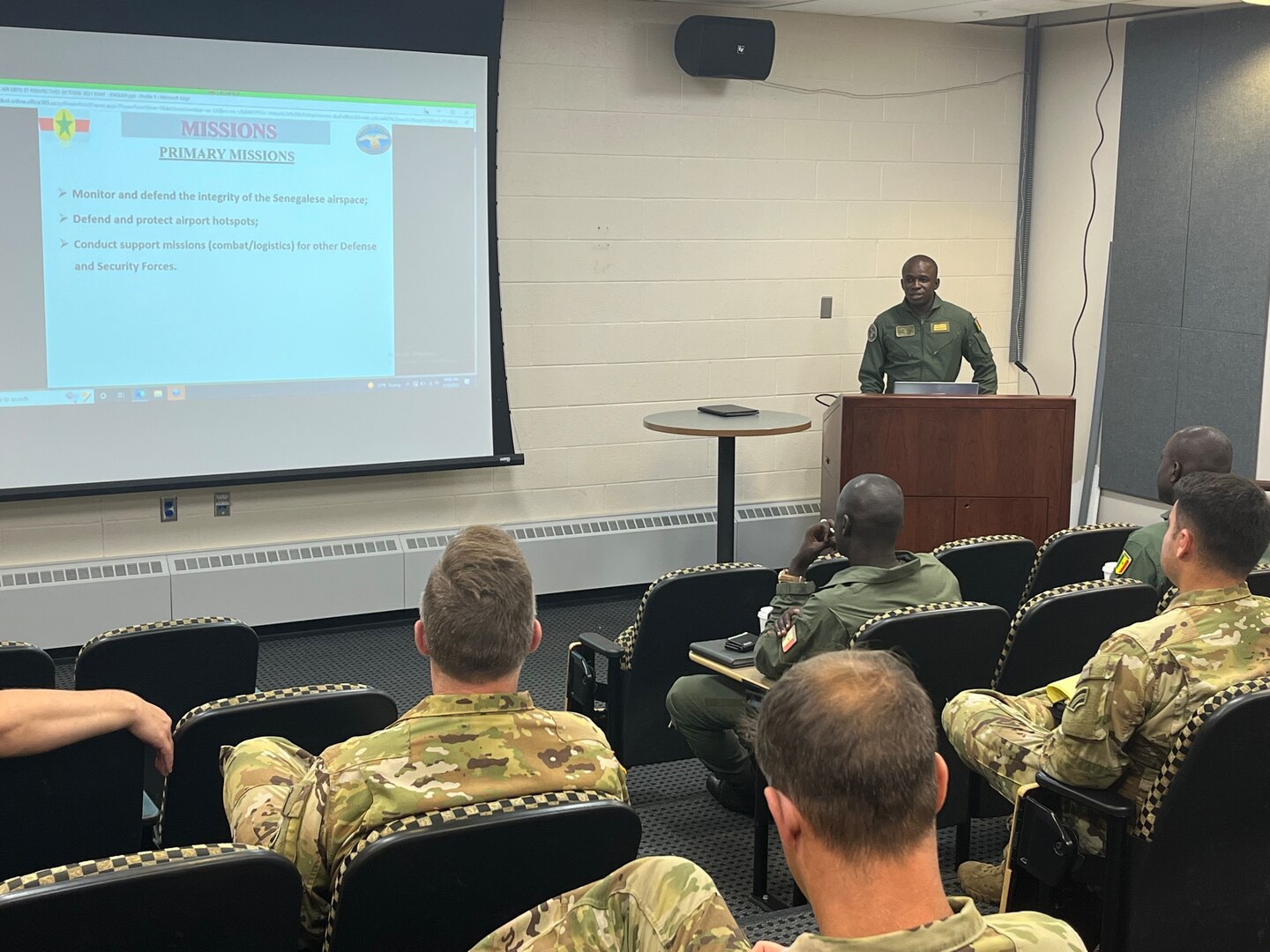 Senegal Air Force Capt. Kana Ndiaye, a helicopter pilot, briefs Vermont Army National Guard Blackhawk pilots during a State Partnership Program visit to the Army Aviation Flight Facility, Burlington, Vermont. The Vermont Army National Guard hosted three Senegalese Air Force pilots July 17-22, 2022, to conduct safety, operations, and maintenance cross-training with VTARNG’s Aviators during the trip. The Department of Defense’s State Partnership Program pairs U.S. state National Guard units with other nations to facilitate international civil-military relationships. (U.S. Army National Guard photo by Sgt. 1st Class Jason Alvarez)