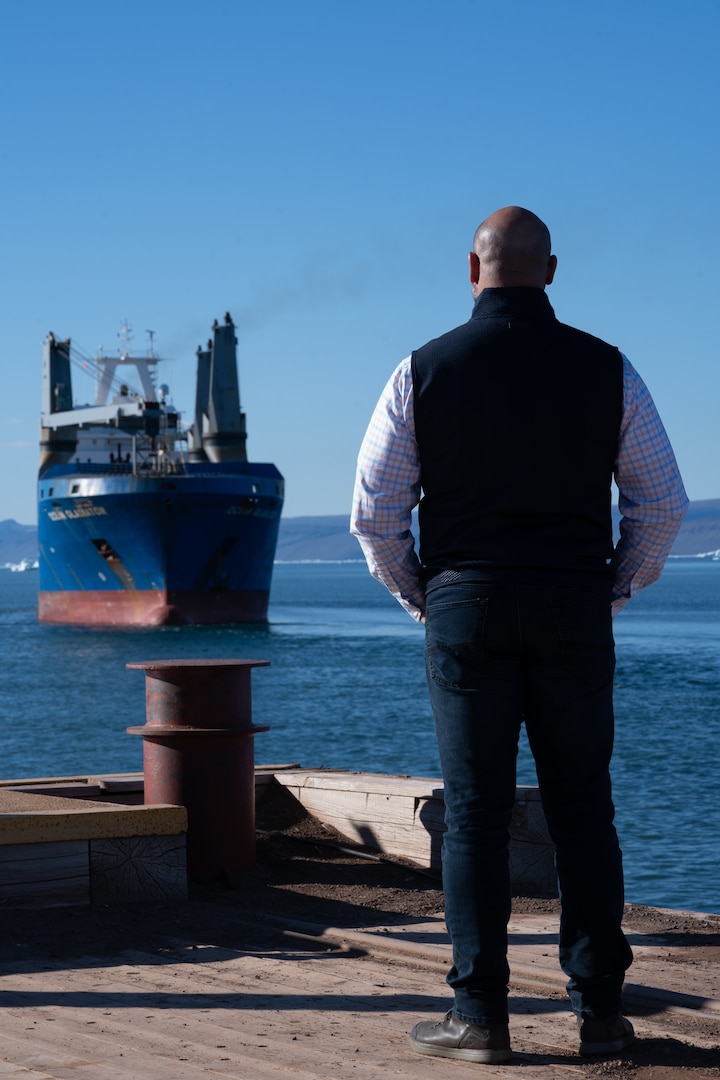 Photo of Nelson Alequin watching the cargo ship leave the port.