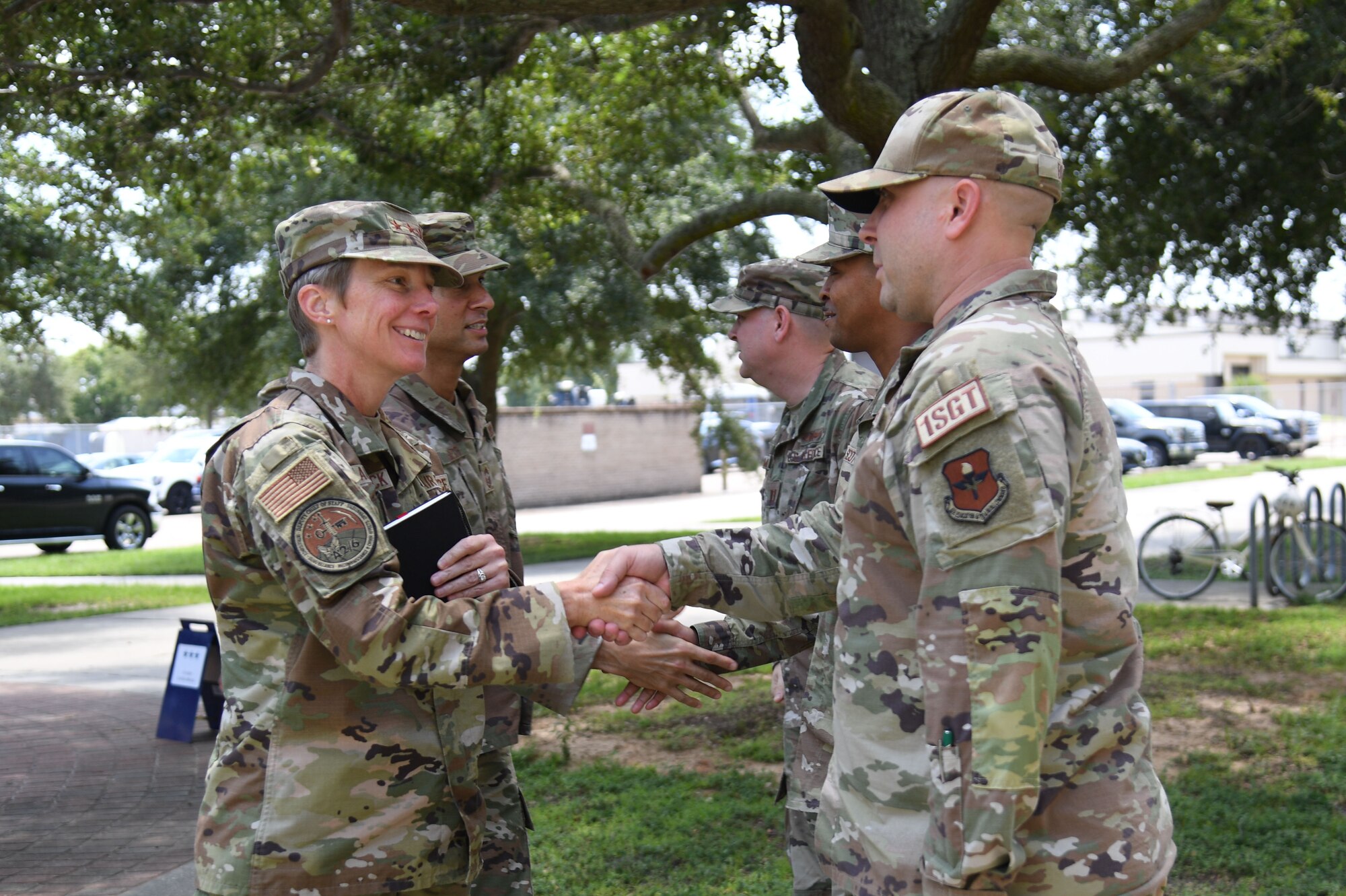 U.S. Air Force Master Sgt. Tony Bozzi, 336th Training Squadron first sergeant, welcomes Lt. Gen. Leah Lauderback, Deputy Chief of Staff for Intelligence, Surveillance, Reconnaissance and Cyber Effects Operations, Headquarters U.S. Air Force, the Pentagon, Arlington, Virginia, to Thomson Hall at Keesler Air Force Base, Mississippi, August 15, 2022. Lauderback and her team toured the 333rd Training Squadron and 336th Training Squadron to meet and greet squadron personnel, understand the squadron's mission and be briefed on new innovations. (U.S. Air Force photo by Kemberly Groue)