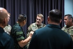 Maj. Joel Johnson, Bilateral Affairs Officer in the Kingdom of Thailand talks with one of his Royal Thai Army counterparts during a State Partnership Program Exchange on July 31, 2022. Johnson serves as the Bilateral Affairs Officer for the Washington National Guard and the Kingdom of Thailand, supporting the National Guard state Partnership Program.