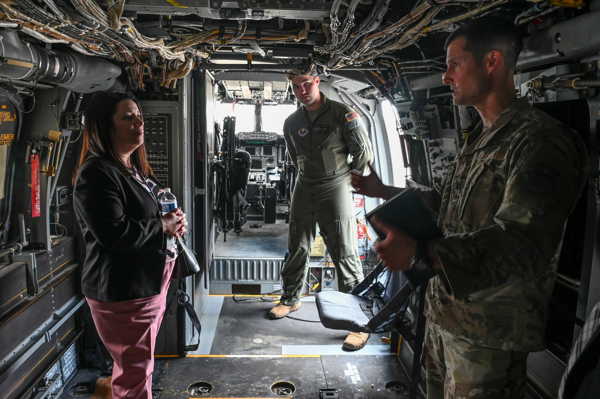 A woman tours a helicopter.