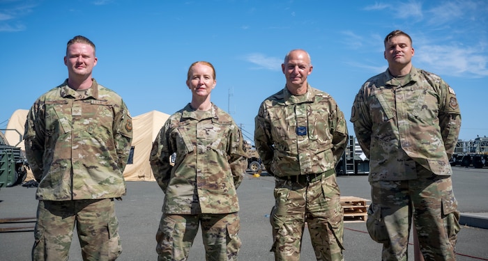 4 Royal Air Force Airmen pose for a photo.