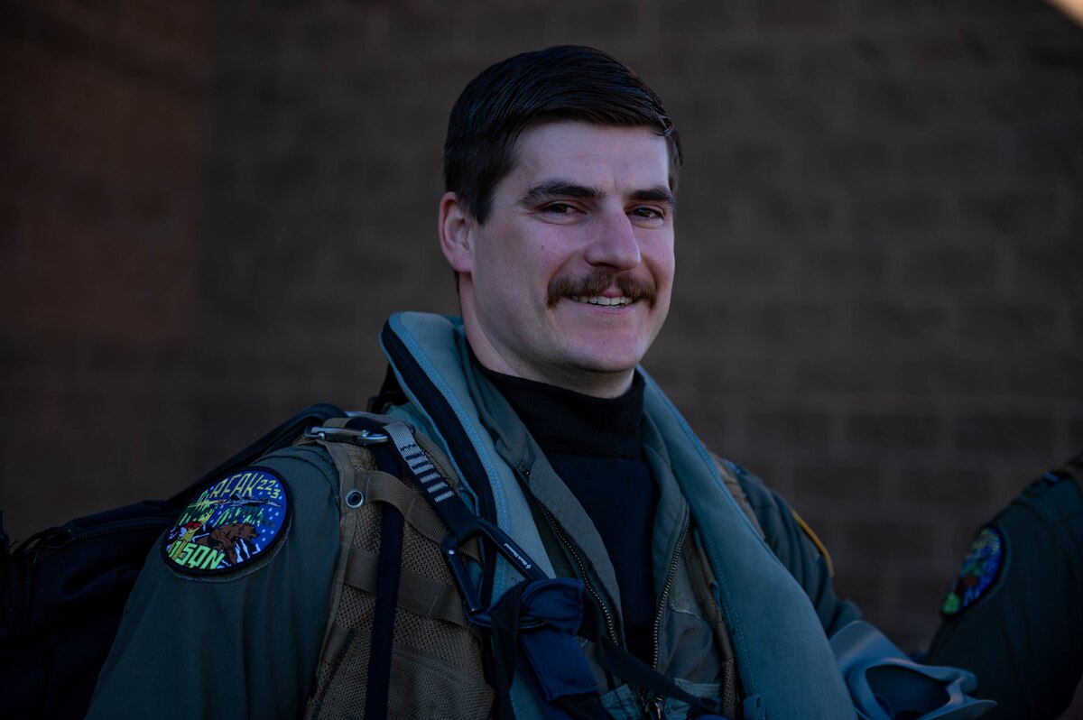 A troop shows off their mustache while at RED FLAG-Alaska