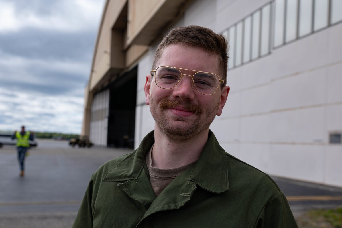 A troop shows off their mustache while at RED FLAG-Alaska