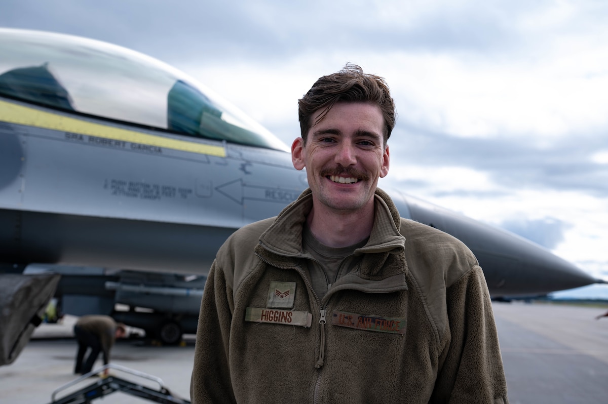 A troop shows off their mustache while at RED FLAG-Alaska