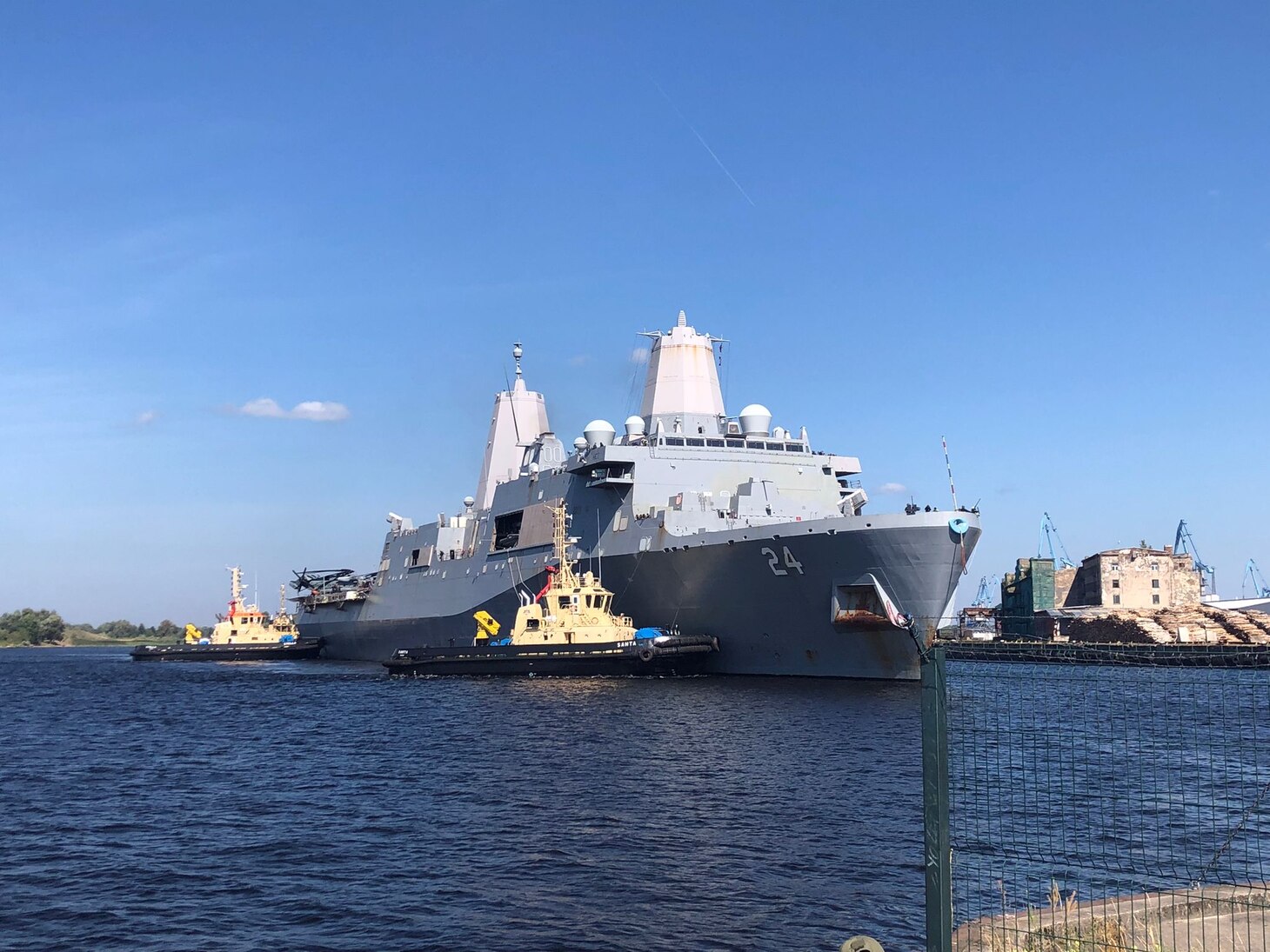The San Antonio-class amphibious transport dock ship USS Arlington (LPD 24) arrives in Riga, Latvia for a scheduled port visit, Aug. 20, 2022.