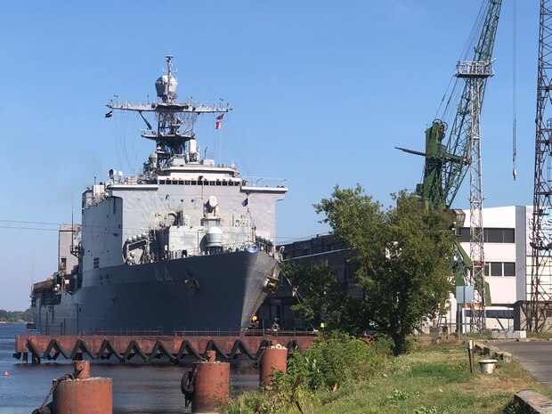 The Whidbey Island-class dock landing ship USS Gunston Hall (LSD 44) sits pierside in Riga, Latvia during a scheduled port visit, Aug. 20, 2022.