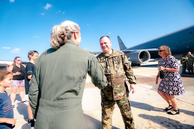 Female commander greets military man