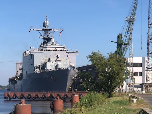 The Whidbey Island-class dock landing ship USS Gunston Hall (LSD 44) sits pierside in Riga, Latvia during a scheduled port visit, Aug. 20, 2022.