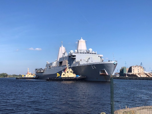The San Antonio-class amphibious transport dock ship USS Arlington (LPD 24) arrives in Riga, Latvia for a scheduled port visit, Aug. 20, 2022.