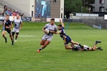 Army Sgt. 1st Class Faleniko Spino of Auburn University breaks free for the score during the championship match of the 2022 Armed Forces Sports Men's Rugby Championship held in conjunction with the Rugbytown 7's Rugby Tournament in Glendale, Colo.  Championship features teams from the Army, Marine Corps, Navy, Air Force (with Space Force players), and Coast Guard.  (Department of Defense photo by Mr. Steven Dinote)