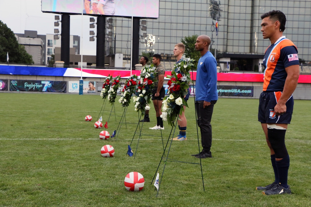 Service members line up for the Fallen Rugger Remembrance Ceremony during the 2022 Armed Forces Sports Men's Rugby Championship held in conjunction with the Rugbytown 7's Rugby Tournament in Glendale, Colo.  Championship features teams from the Army, Marine Corps, Navy, Air Force (with Space Force players), and Coast Guard. (Department of Defense photo by Mr. Steven Dinote)