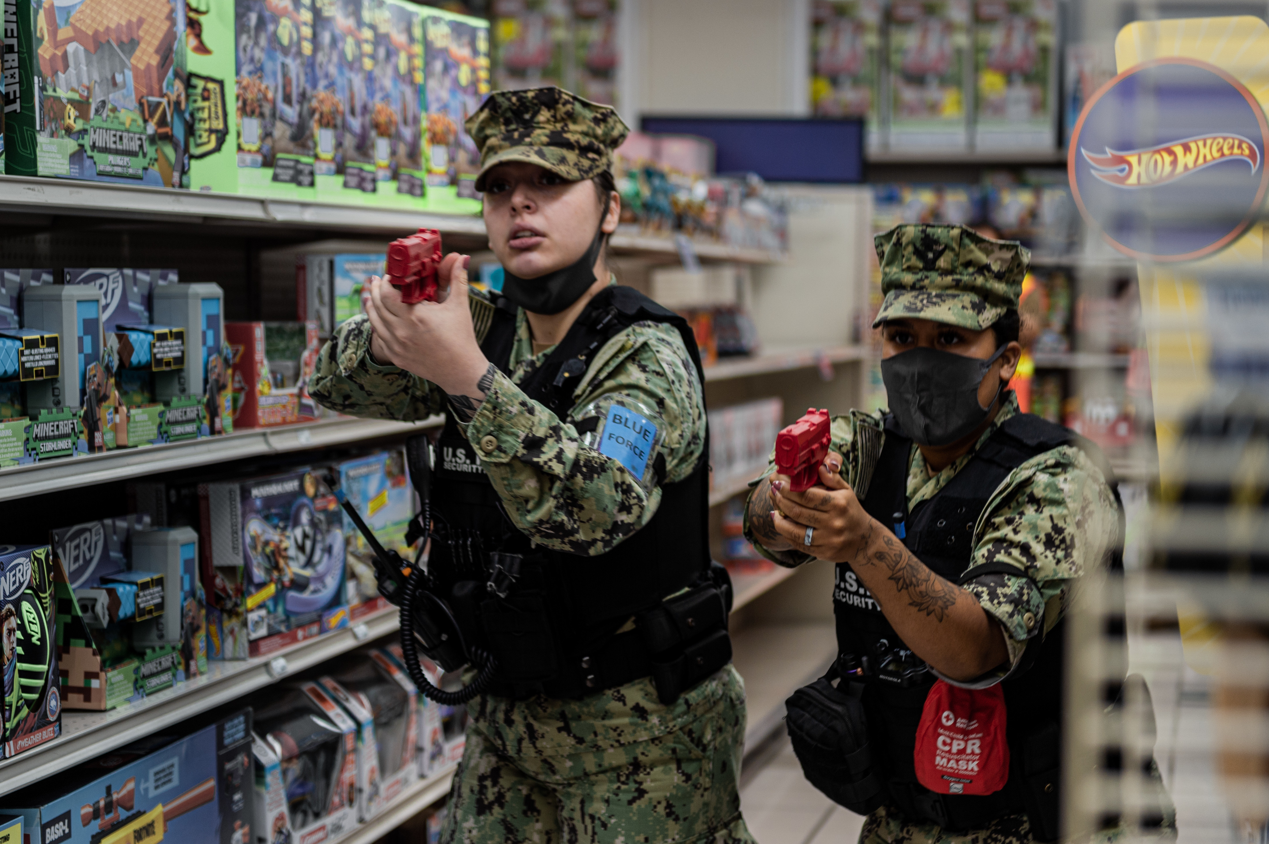 YOKOSUKA, Japan (August 16, 2022) Master-at-Arms 3rd Class Michaela Kane and Master-at-Arms Third Class Veronica Velez give orders to a suspect during an Integrated Training Team (ITT) drill.