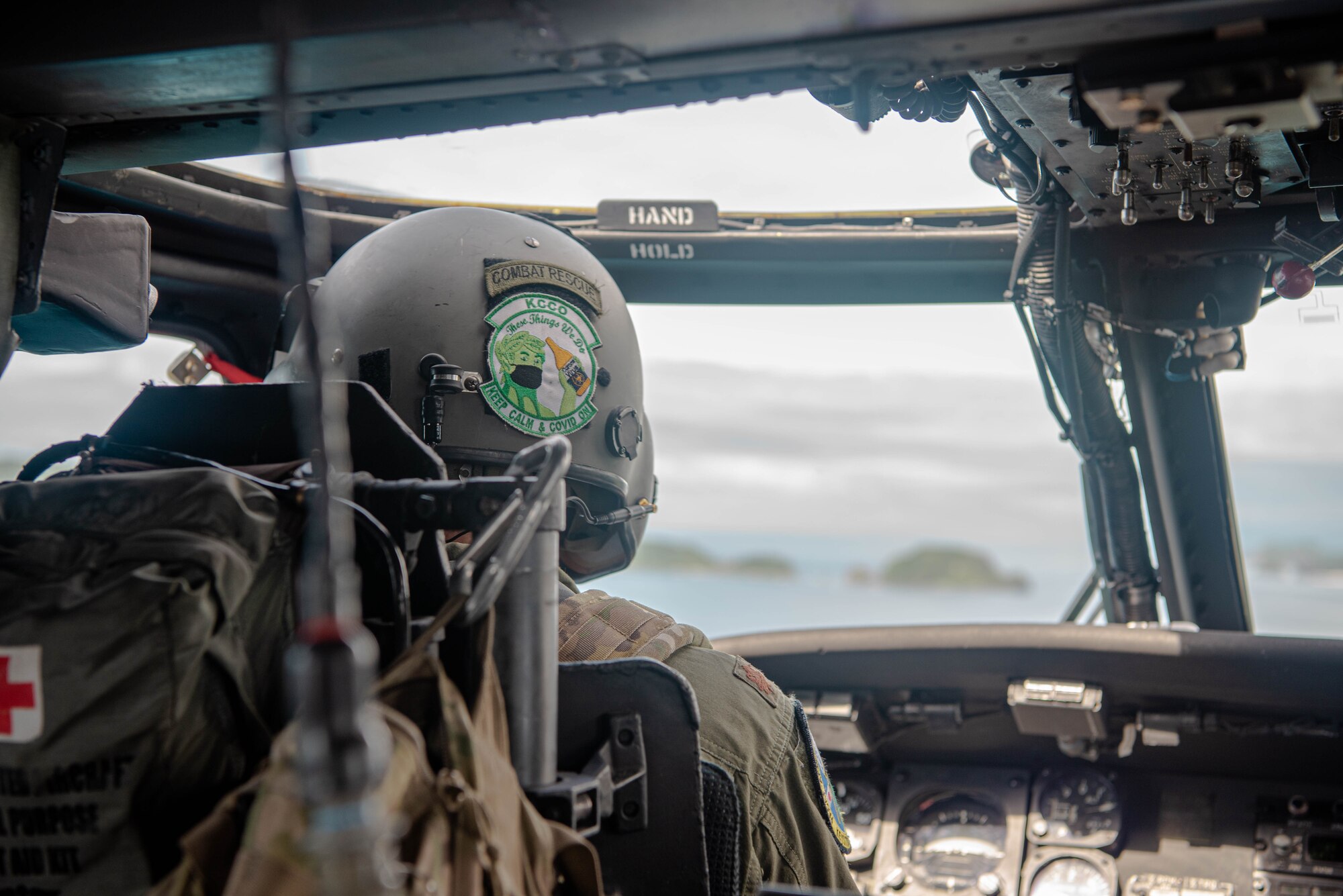 An Airman pilots a helicopter.