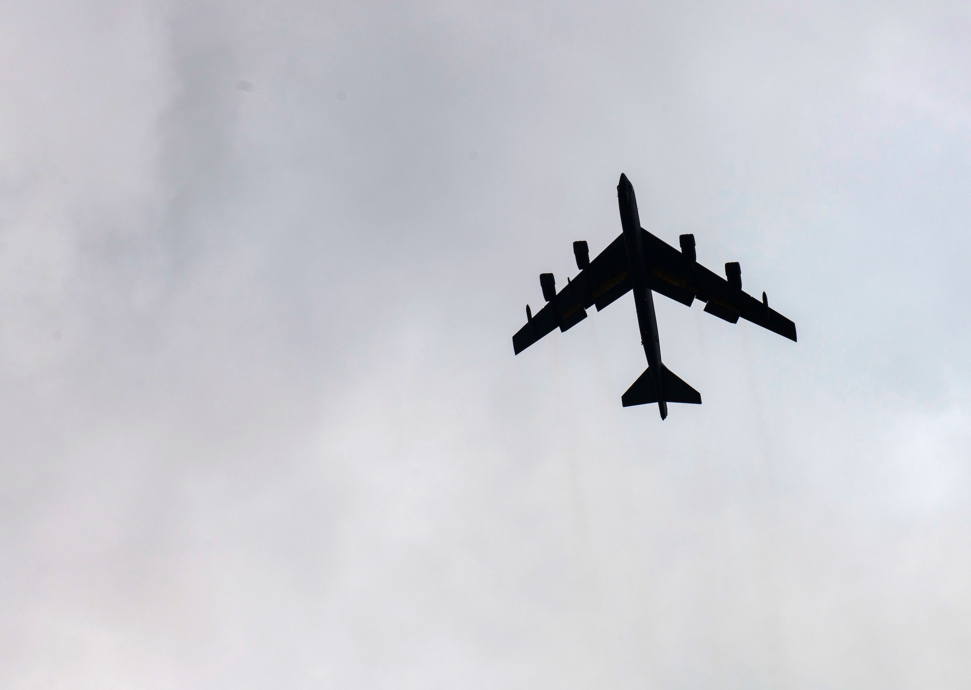 A B-52 Stratofortress aircraft, assigned to the 23rd Expeditionary Bomb Squadron, flies over RAF Fairford
