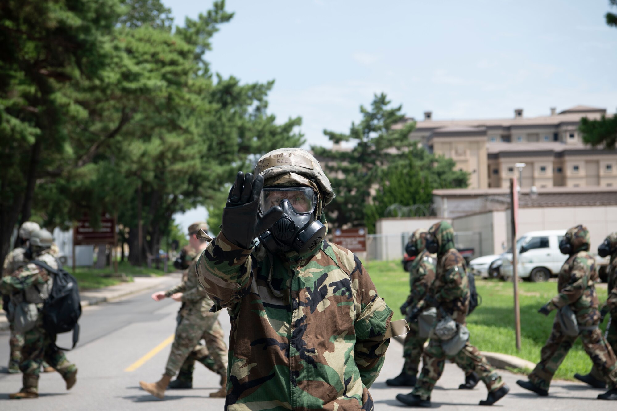 Maj. Walter Beeland III, 8th Medical Operations Squadron warrior medicine flight commander, stands as a road guard during a training event at Kunsan Air Base, Republic of Korea, Aug. 17, 2022. Training reinforces Airmen readiness, strengthens capabilities and ensures the Wolf Pack has the ability to defend the base, accept follow-on forces and take the fight north. (U.S. Air Force photo by Staff. Sgt Sadie Colbert)