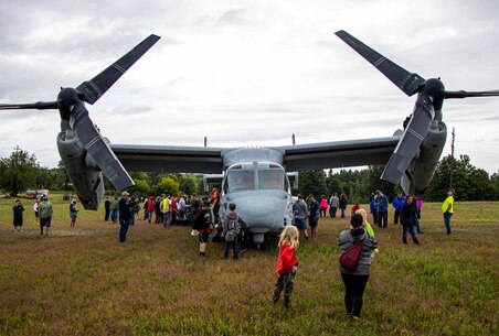 U.S. Marines with Recruiting Station Lansing and Marine Medium Tiltrotor Squadron 365 give tours of a MV-22 Osprey at the Drew Kostic Memorial 5K near Traverse City, Michigan on August 13, 2022. The U.S. Marine Corps provided static displays, tours, and demonstrations of aircraft to allow the familiarization with the equipment and opportunities the Marine Corps offers. (U.S. Marine Corps photo by Sgt. Jesse Carter-Powell)