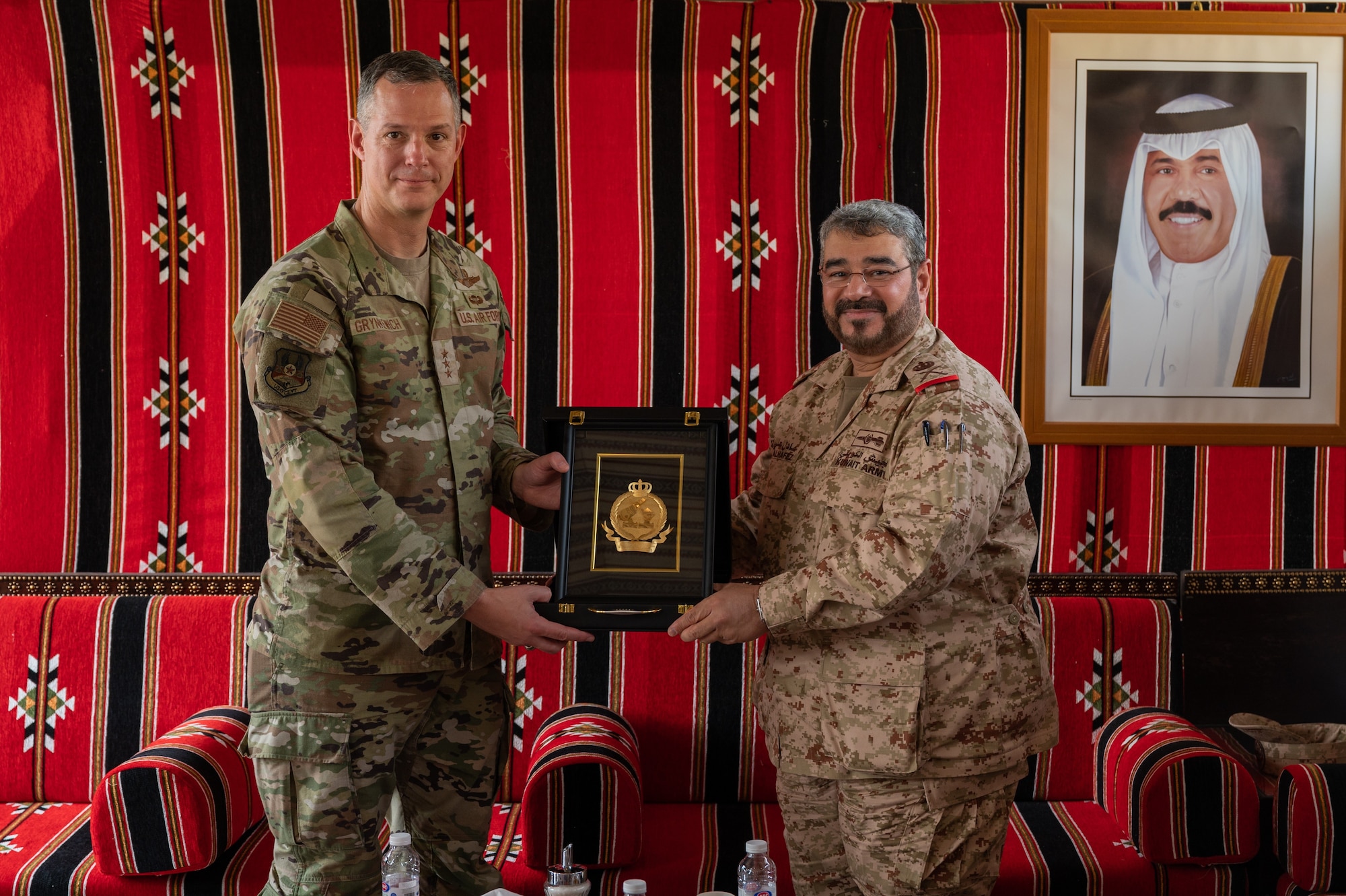 U.S. Air Force Lt. Gen. Alexus G. Grynkewich, left, Ninth Air Force (Air Forces Central) commander, receives a gift from Brig. Gen. Adel Al-Hafez, right, Kuwait Air Defense command chief, at the Kuwait Air Defense Headquarters, Aug. 17, 2022. During the visit, Grynkewich met with Kuwaiti military leaders to discuss the importance of resolute partnerships within the U.S. Central Command area of responsibility. (U.S. Air Force photo by Senior Airman Dominic Tyler)
