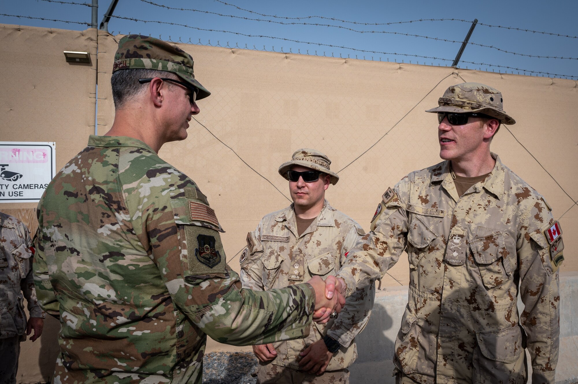 U.S. Air Force Lt. Gen. Alexus G. Grynkewich, left, Ninth Air Force (Air Forces Central) commander, meets with Canadian Armed Forces Brigadier-General Wade Rutland, Commander Joint Task Force – Impact / Task Force – Central, at Camp Canada at Ali Al Salem Air Base, Kuwait, Aug. 18, 2022. During the visit, Grynkewich met with Canadian military members to discuss the importance of partner nation integration within the U.S. Central Command area of responsibility. (U.S. Air Force photo by Senior Airman Dominic Tyler)