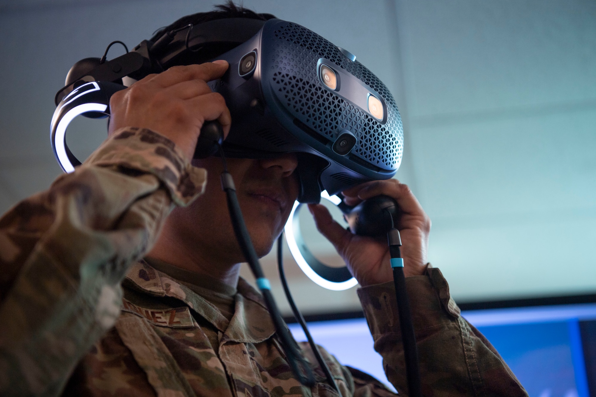 Staff Sgt. Javier Rodriguez, 325th Civil Engineer Squadron geobase technician, tries out the Digital Twin virtual reality goggles, March 10, 2022 at Tyndall Air Force Base, Fla.  (U.S. Air Force photo by Staff Sgt. Janiqua P. Robinson)
