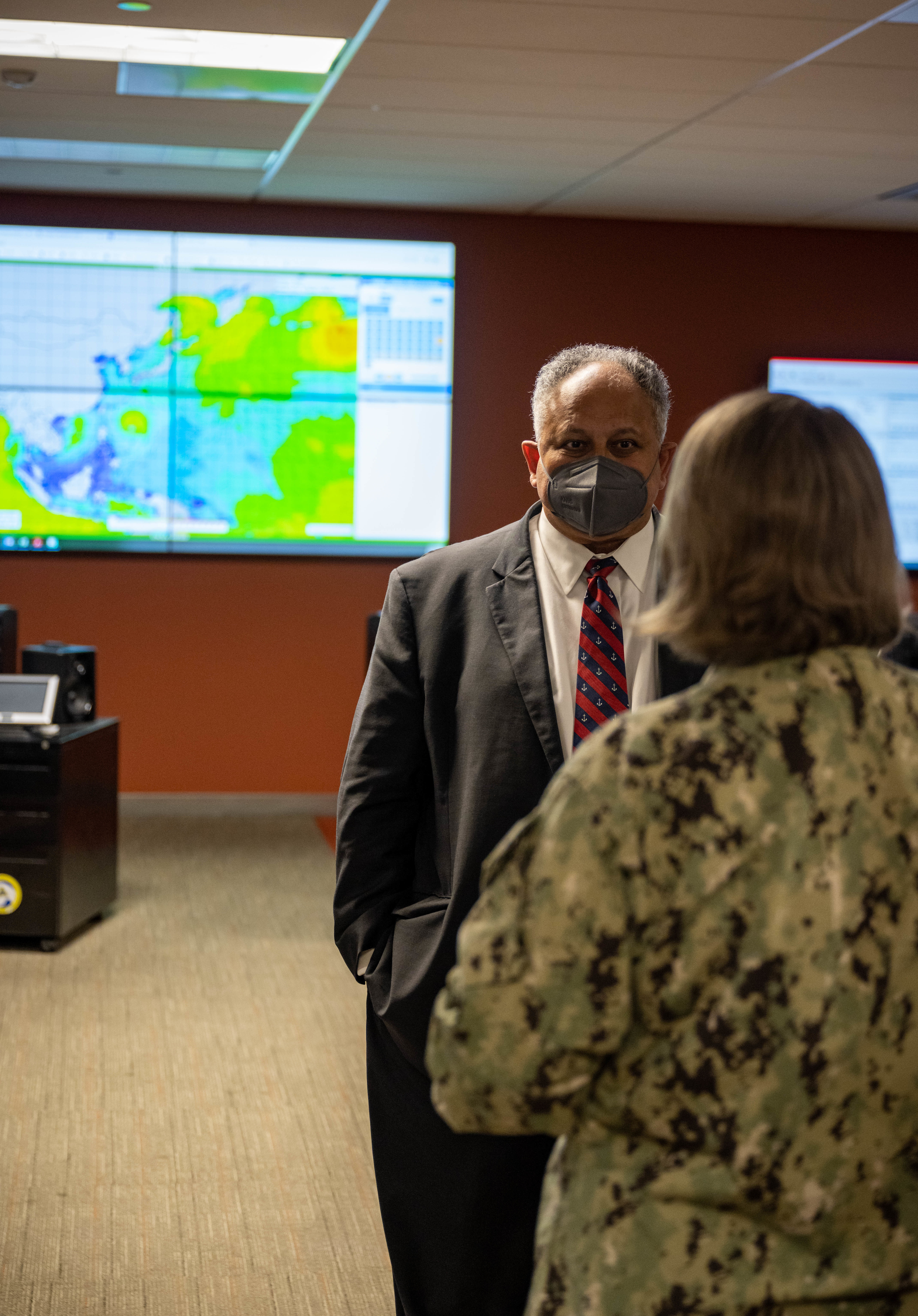 Secretary of the Navy Carlos Del Toro receives a tour of facilities at the Fleet Numerical Meteorology and Oceanography Center (FNMOC) from Capt. Christi Montgomery, commanding officer of FNMOC, in Monterey Aug. 18, 2022.