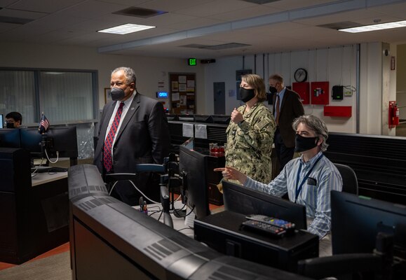 Secretary of the Navy Carlos Del Toro receives a tour of facilities at the Fleet Numerical Meteorology and Oceanography Center (FNMOC) from Capt. Christi Montgomery, commanding officer of FNMOC, in Monterey Aug. 18, 2022.