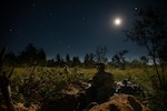 Infantry Soldiers assigned to 1st Battalion, 148th Infantry Regiment man their foxholes before force-on-force operations during Operation Northern Strike at Camp Grayling, Mich., Aug. 15, 2022.