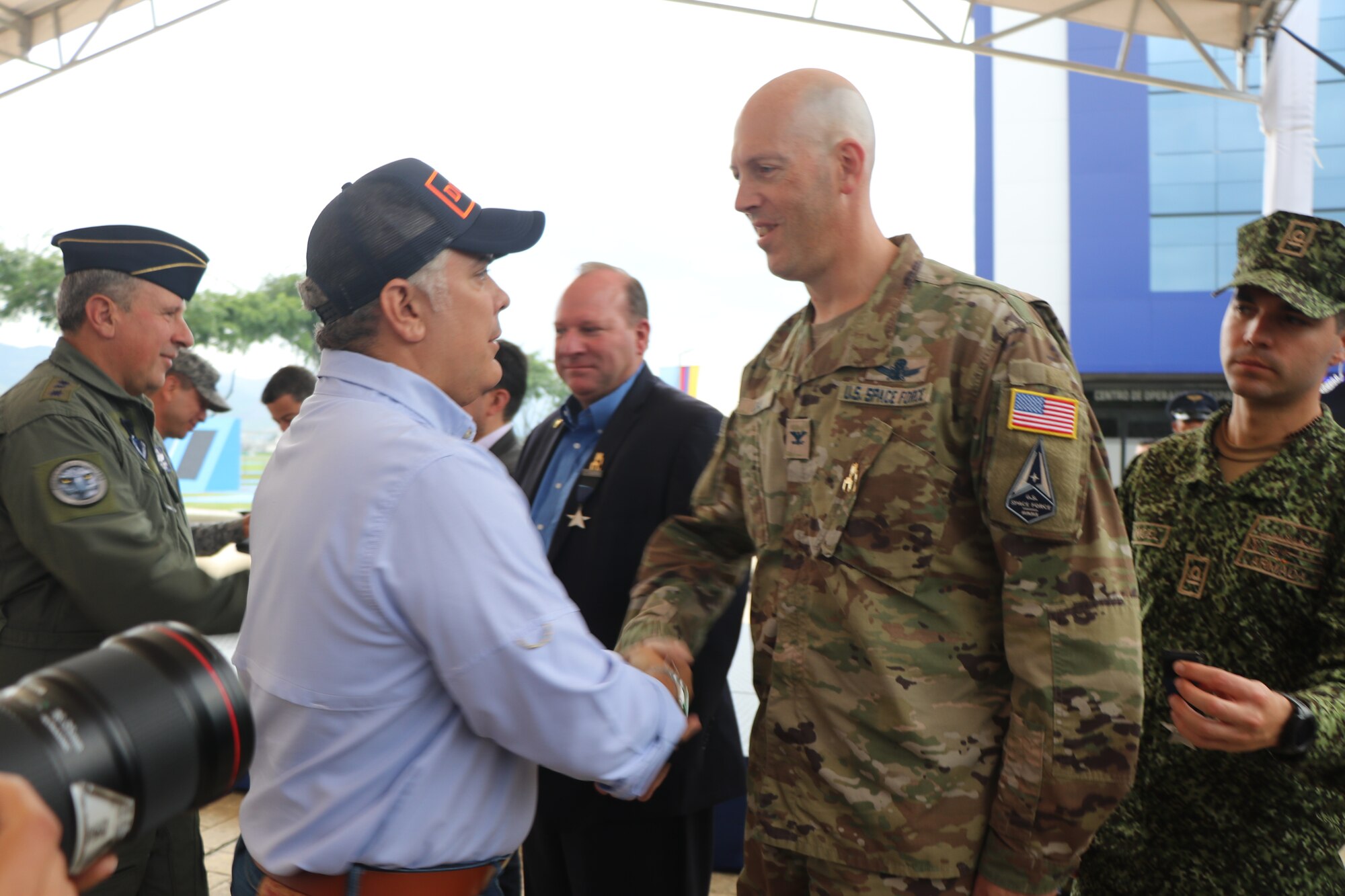 Colombian President Iván Duque Márquez presents Air University Space Chair Space Force Col. Galen Ojala with the country’s inaugural Ad Astra Medal during a ceremony July 28, 2022, at the Colombia Air Force Academy in Cali. Ojala and several others were awarded the medal for their efforts in helping Colombia with its emerging national space program. Ojala received the Ad Astra (To the Stars) Medal for his service as U.S. Southern Command’s director of Space Forces within Air Forces Southern at Davis-Monthan AFB, Ariz., between 2018 and 2021. He joined Air University as its space chair in June 2021 (Courtesy photo)