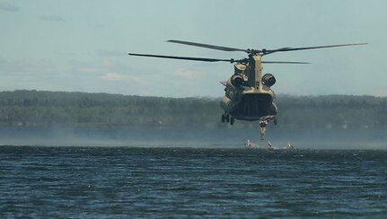 U.S. Army Soldiers with 20th Special Forces Group (Airborne), Alabama National Guard, and 2nd Squadron, 107th Cavalry Regiment, Ohio National Guard, conduct helocast operations from a CH-47 Chinook helicopter into Lake Margrethe during Northern Strike at Camp Grayling, Mich., Aug. 11, 2022.