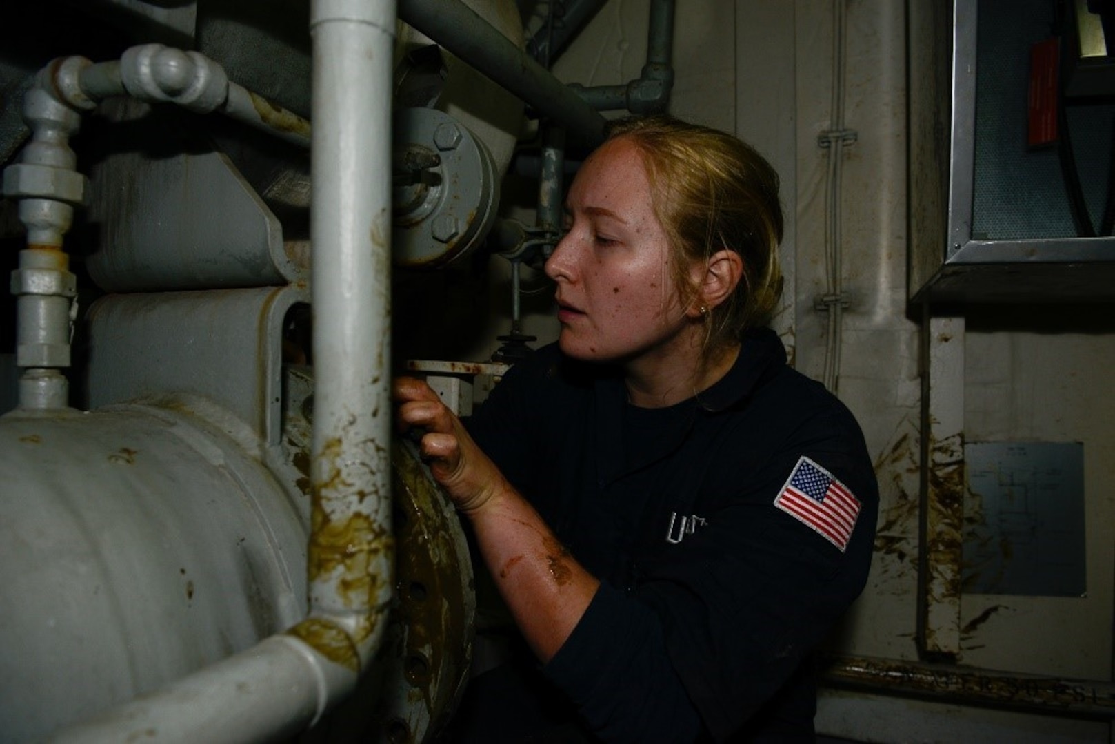 Petty Officer 2nd Class Leanne M. Rensch, winner of the Master Chief Petty Officer Pearl Faurie Women's Leadership Award, works on an air conditioner unit aboard the Coast Guard Cutter Hamilton Apr. 21, 2022. Photo by Petty Officer 2nd Class Sydney