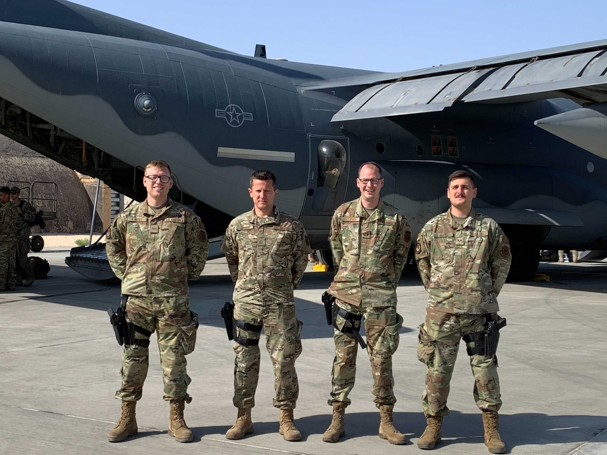 Airmen assigned to the 332nd Expeditionary Operations Support Squadron pose for a group photo September 2021, at an undisclosed location in the United States Central Command area of responsibility.