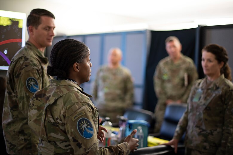 U.S. Space Force 1st Lt. DeShawna Moore, SPACE FLAG 22-3 exercise director, provides Lt. Gen. Nina Armagno, U.S. Space Force Chief of Staff, a status on simulated orbital warfare engagements