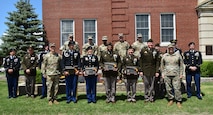 Soldiers, Commanders, and panel of judges pose in front of the 3rd Recruiting Brigade Headquarters.