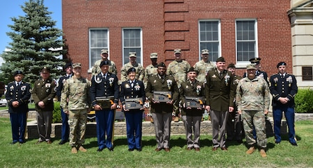 Soldiers, Commanders, and panel of judges pose in front of the 3rd Recruiting Brigade Headquarters.