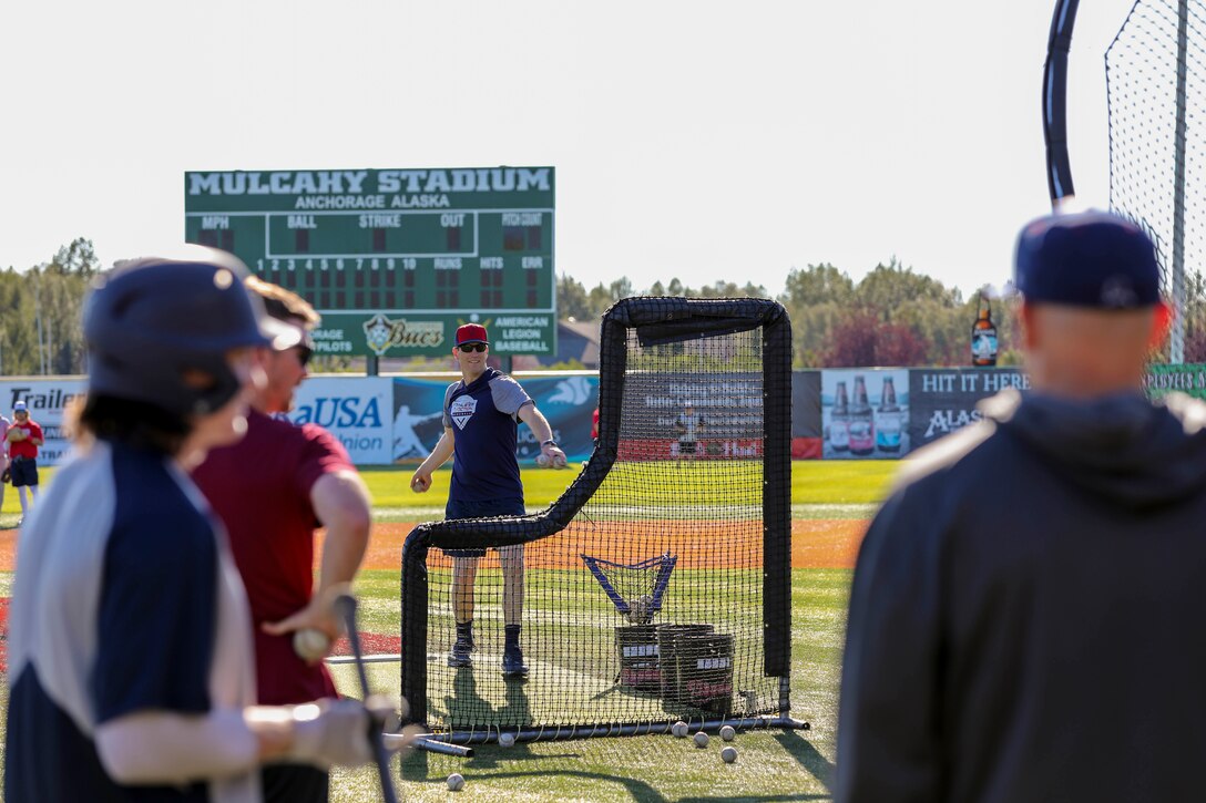 Alaska National Guard State Command Chaplain (Col.) Ted McGovern pitches a baseball during a warm-up exercise before a game at the Mulcahy Stadium in Anchorage, Alaska, July 23, 2022. In addition to serving the Alaska Guard family, McGovern serves the communities surrounding Joint Base Elmendorf-Richardson as an assistant coach for the Chugiak-Eagle River Chinooks, a local collegiate baseball team in Chugiak. (Alaska National Guard photo by 1st Lt. Balinda O’Neal)