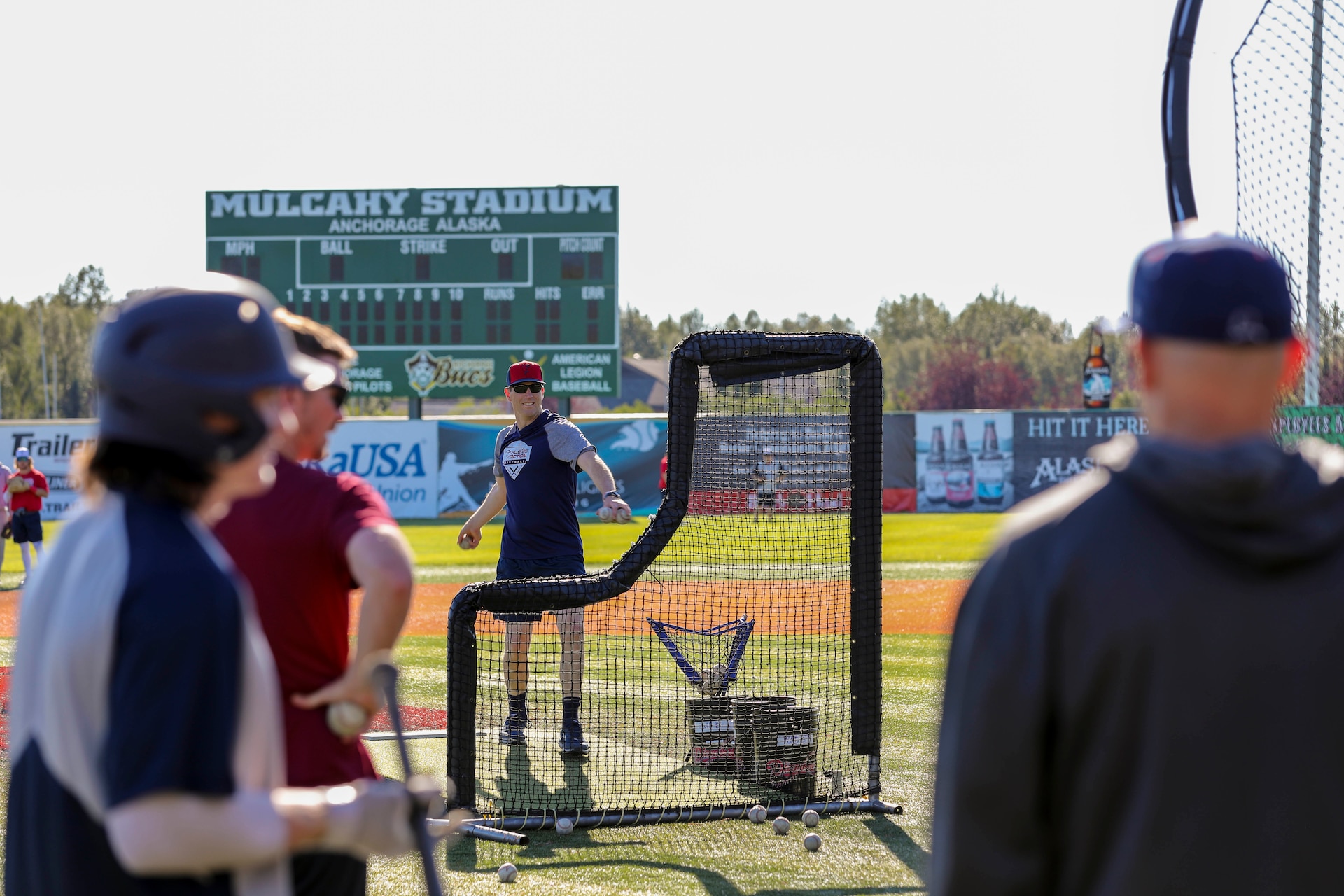 Alaska National Guard State Command Chaplain (Col.) Ted McGovern pitches a baseball during a warm-up exercise before a game at the Mulcahy Stadium in Anchorage, Alaska, July 23, 2022. In addition to serving the Alaska Guard family, McGovern serves the communities surrounding Joint Base Elmendorf-Richardson as an assistant coach for the Chugiak-Eagle River Chinooks, a local collegiate baseball team in Chugiak. (Alaska National Guard photo by 1st Lt. Balinda O’Neal)