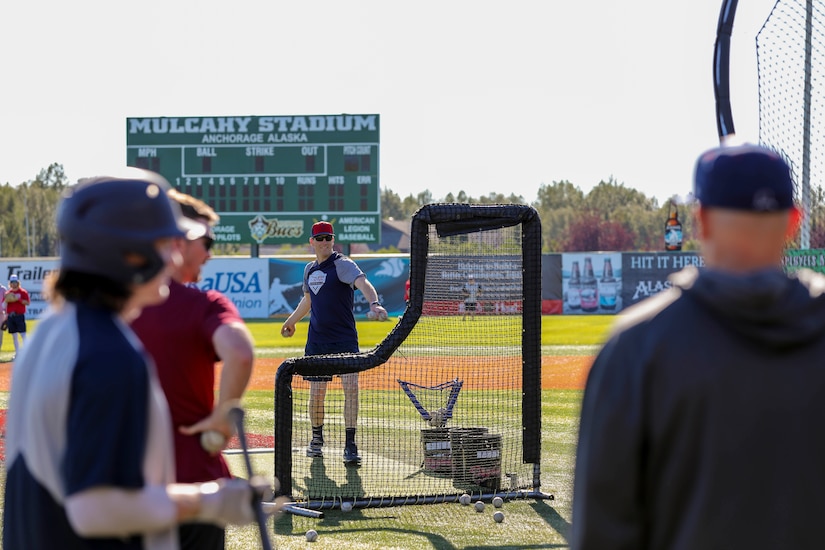 Alaska National Guard State Command Chaplain (Col.) Ted McGovern pitches a baseball during a warm-up exercise before a game at the Mulcahy Stadium in Anchorage, Alaska, July 23, 2022. In addition to serving the Alaska Guard family, McGovern serves the communities surrounding Joint Base Elmendorf-Richardson as an assistant coach for the Chugiak-Eagle River Chinooks, a local collegiate baseball team in Chugiak. (Alaska National Guard photo by 1st Lt. Balinda O’Neal)